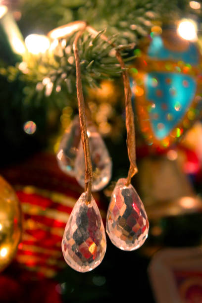 istock Crystal drops on old fashioned Christmas tree - unfocused background 943866860