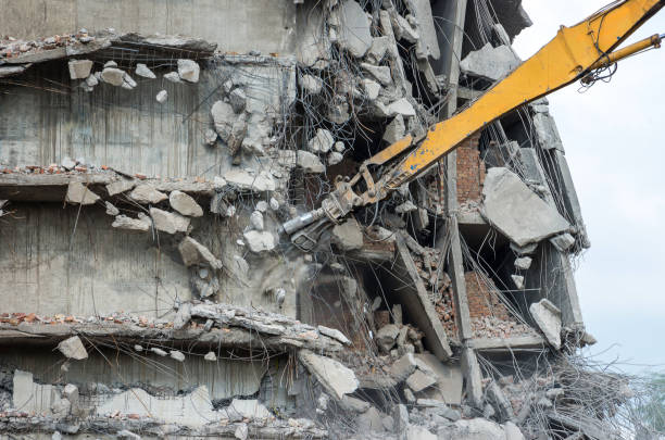 istock Building demolition with hydraulic excavator 943878844