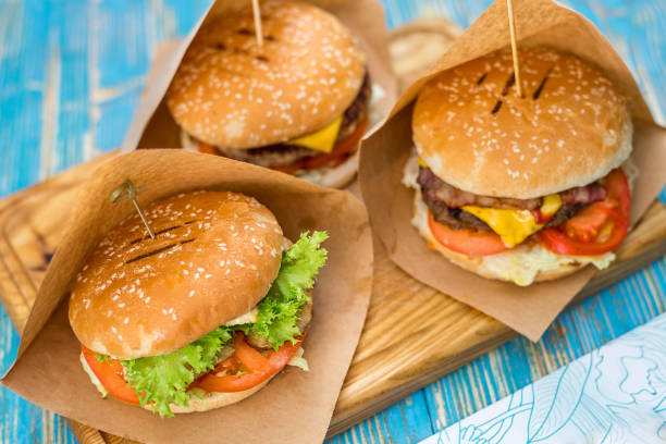 istock three different sandwiches on a wooden plate 943878876