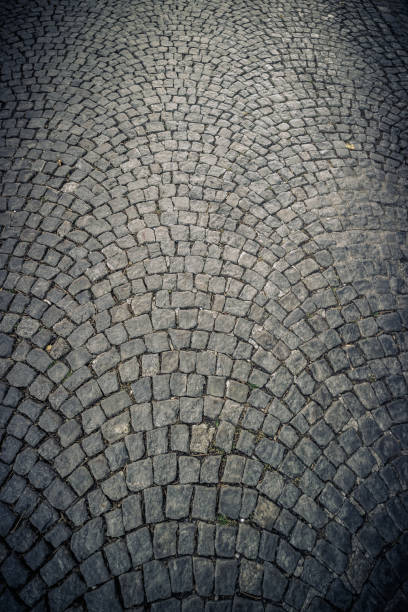 istock Texture of cobble stone pavement tiles 943885346
