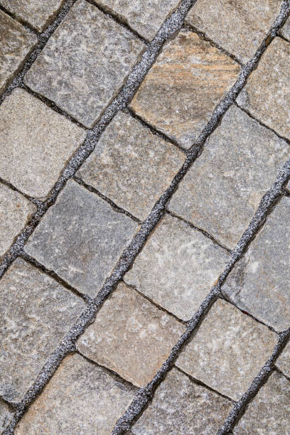 istock Texture of cobble stone pavement tiles 943885414