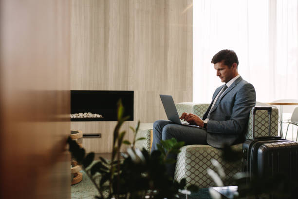istock Executive in airport business lounge waiting for flight 943887938