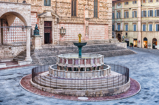 View of Fontana Maggiore, monumental medieval fountain located between the cathedral and the Palazzo dei Priori in the city of Perugia, Italy