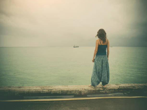 istock Woman on pier 943902704