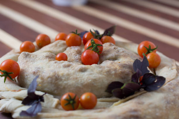 istock spiral filo pie burek with cherry tomatoes 943903702