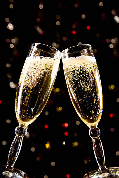 istock Two champagne glasses making toast 94390634