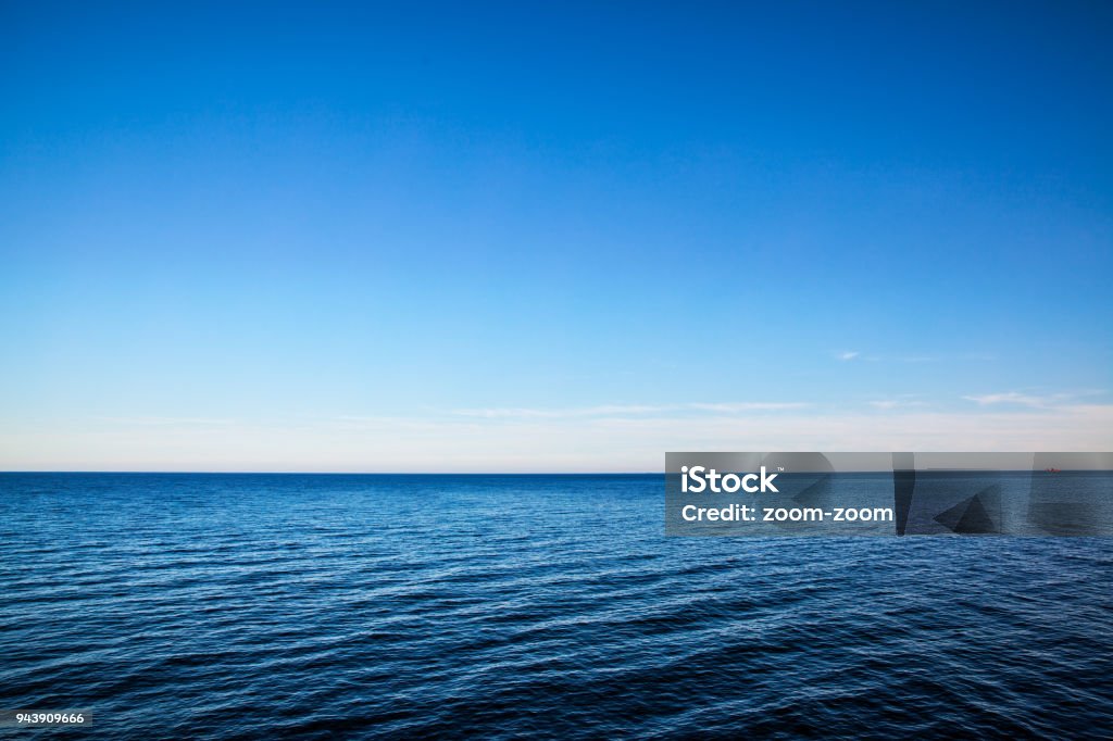 Seascape with sea horizon - Background Seascape with sea horizon and almost clear deep blue sky - Background Sea Stock Photo