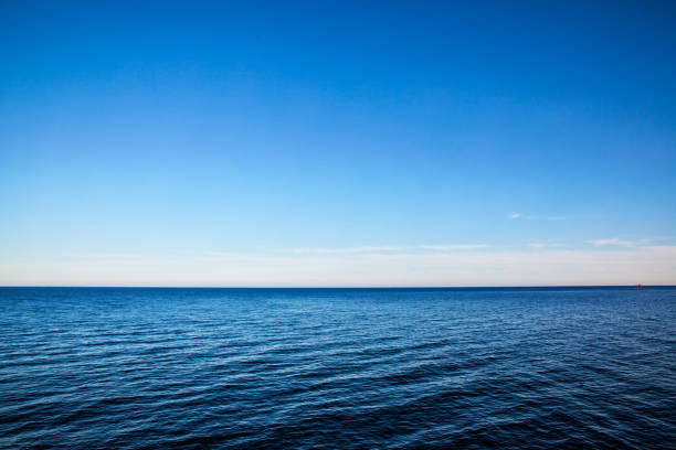 Seascape with sea horizon - Background Seascape with sea horizon and almost clear deep blue sky - Background sea stock pictures, royalty-free photos & images