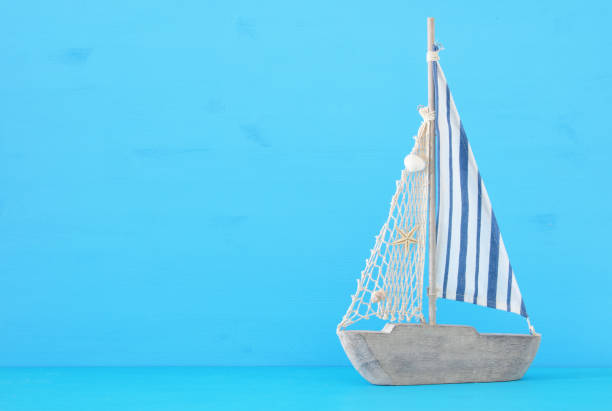 istock nautical concept with sail boat over blue background. 943909852