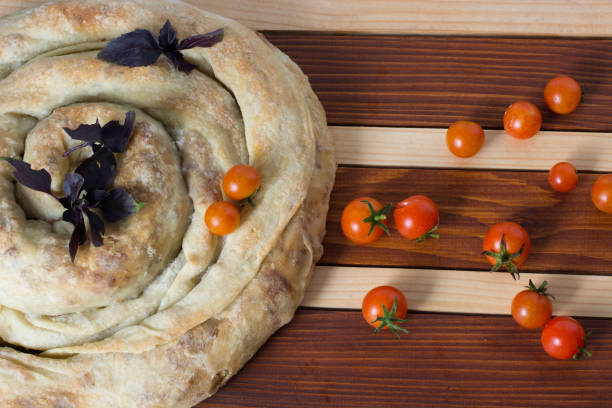 istock spiral filo pie burek with cherry tomatoes 943910312