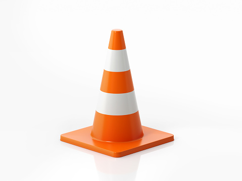 Orange colored traffic cone on white background. Horizontal composition with  copy space. Clipping path is included.