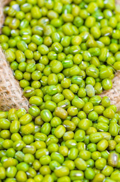 istock beans in sack, isolated on white background 943917180