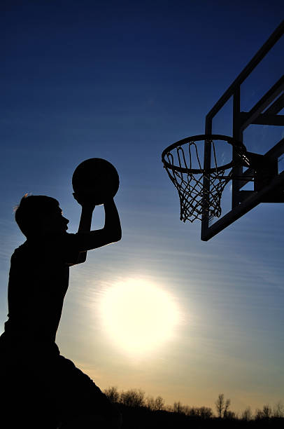 istock Teen Boy Going For The Dunk 94392031