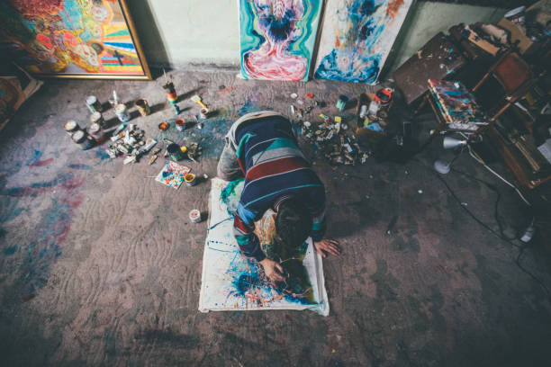 istock Man painting on the floor 943920422