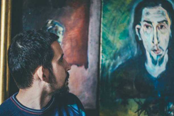 Artist looking his portrait