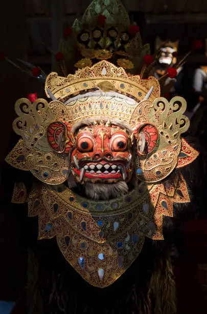 Photo of Traditional Balinese mask on a black background.
