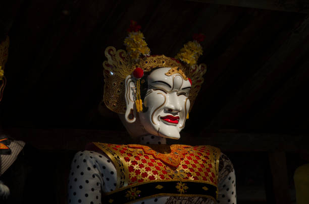 Traditional Balinese mask on a black background.