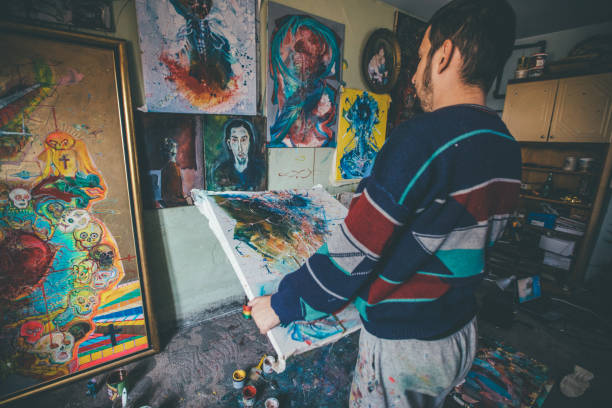 istock Man thinking about the painting 943928238