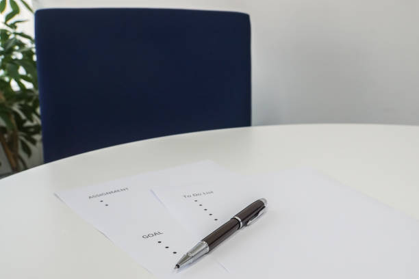 istock selective focus write business goals on mock up sheet with pen on office desk 943932046