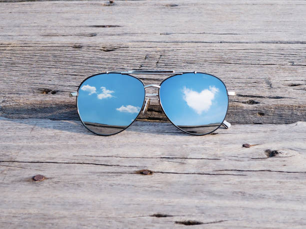 istock Reflection of blue sky on sunglasses 943935414