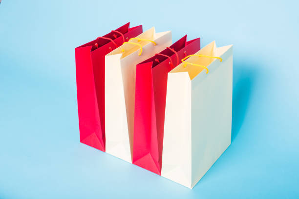 istock Paper shopping bags on blue background 943939554