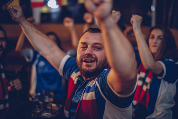 istock Excited fans celebrating 943943520