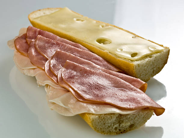 istock Sliced Turkey, Ham and Swiss Cheese sandwich 94394615