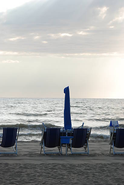 istock Sunbeds at beach seaside resort 94395240