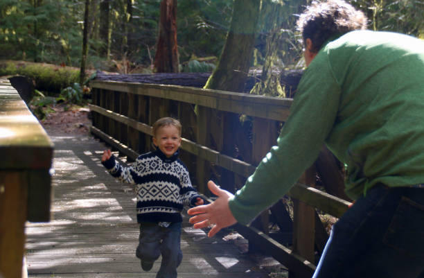 istock Joyful Child Running Toward Father 943956138