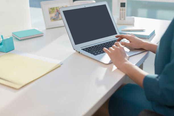 istock Young Woman at Office with Laptop 943963396