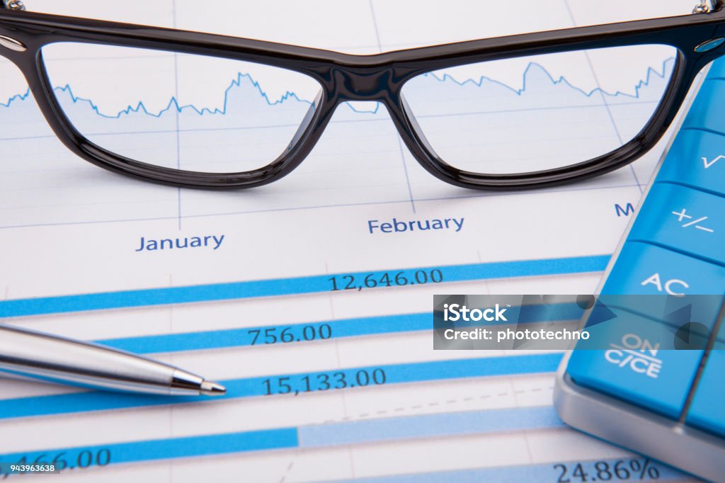 Calculator, pen and business balance Finance Stock Photo