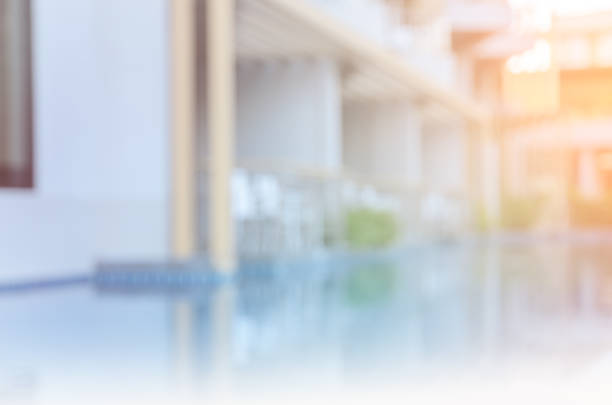 istock Blurry outdoor swimming pool background. Filtered effect image 943963854