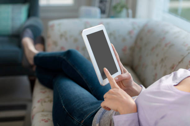 istock Woman at Home with a Tablet 943963960