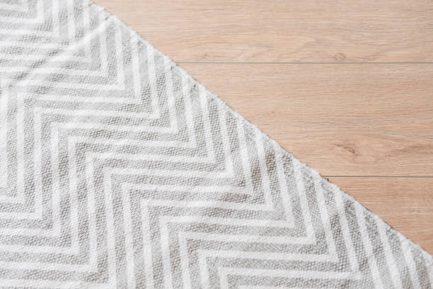 istock Light laminate parquete floor with carpet 943964738