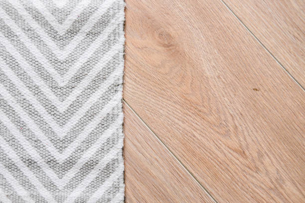 istock Light laminate parquete floor with carpet 943964744