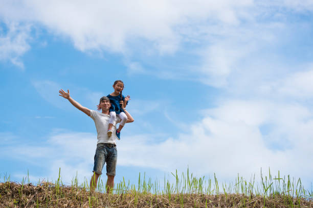 istock Father and daughter playing in the meadow 943968056
