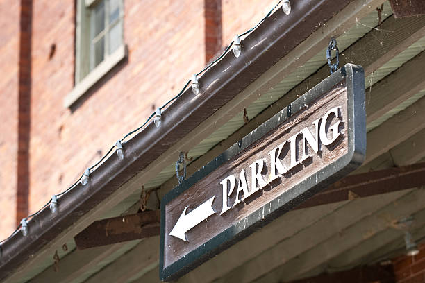 istock Custom Parking sign with arrow on side of building 94397865