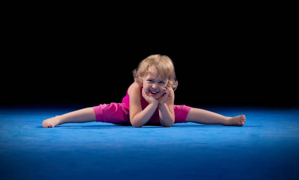 little girl in sports hall - small gymnastics athlete action imagens e fotografias de stock