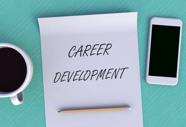 istock CAREER DEVELOPMENT, message on paper, smart phone and coffee on table, 3D rendering 943979920