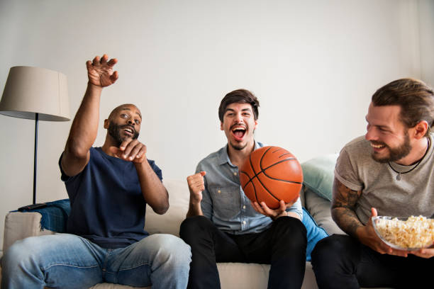istock Friends cheering sport league together 943982920