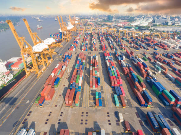 istock Logistics and transportation of Container Cargo ship and Cargo working crane bridge in shipyard 943987258