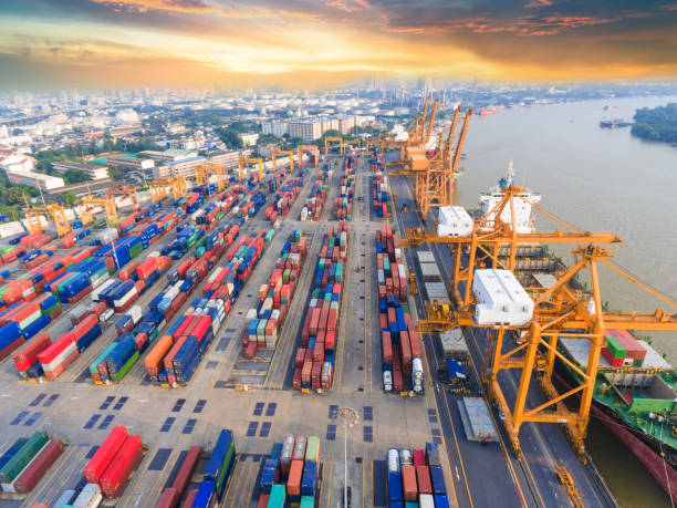 istock Logistics and transportation of Container Cargo ship and Cargo working crane bridge in shipyard 943988514