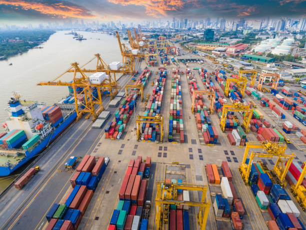 istock Logistics and transportation of Container Cargo ship and Cargo working crane bridge in shipyard 943988800