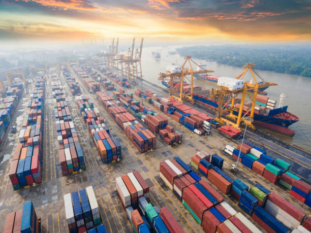 istock Logistics and transportation of Container Cargo ship and Cargo working crane bridge in shipyard 943988822