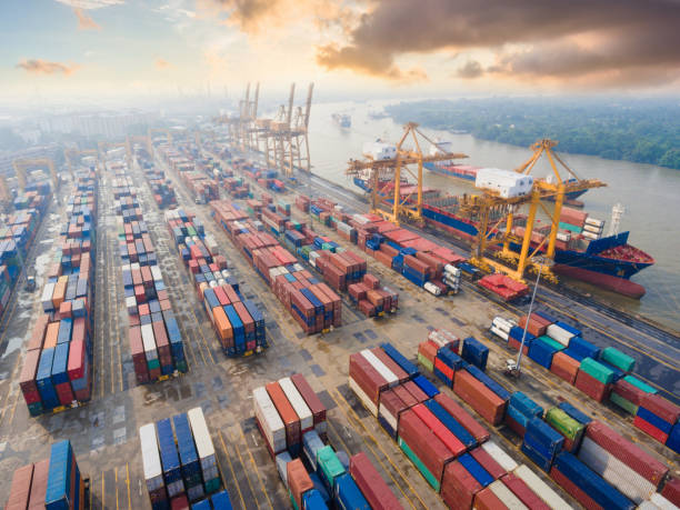 istock Logistics and transportation of Container Cargo ship and Cargo working crane bridge in shipyard 943988848
