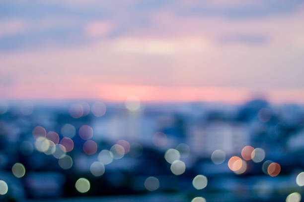 istock abstract blur bokeh of night light city with mountain 943999260