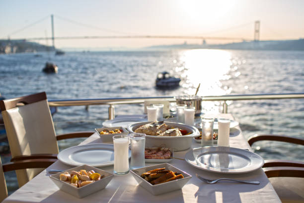 istock Romantic Turkish  Traditional Dinning Table with Special Alcohol Drink Raki, and Beautiful Istanbul Bosphorus View 943999828