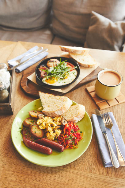 istock Hot breakfast dish of fried eggs and coffee on table 944003522