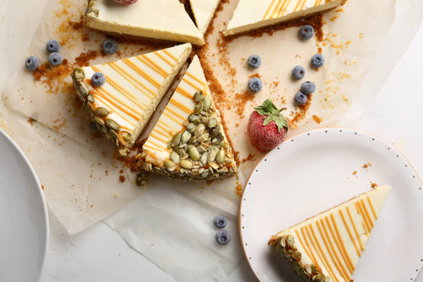 istock Sliced tasty cheesecake with berries, food flat lay 944004808