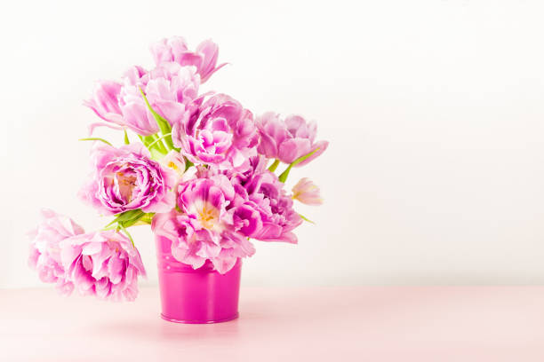 istock Beautiful Bunch of Peony Style Tulips on the Pink Pot 944007766